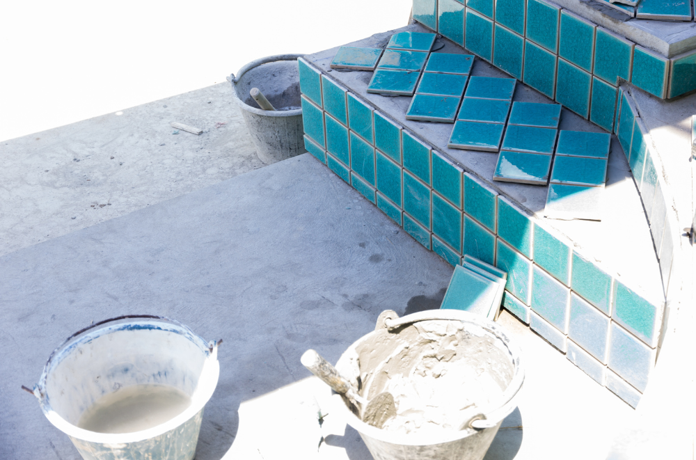 Tiles and plaster buckets used for pool restoration