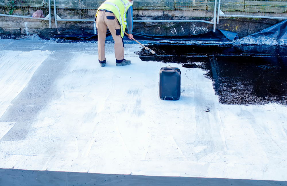 Employee from a pool remodeling company replastering a pool